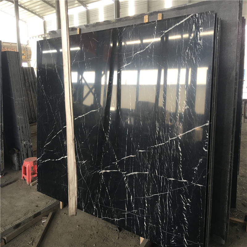 Nero Marquina Marble i vit rand