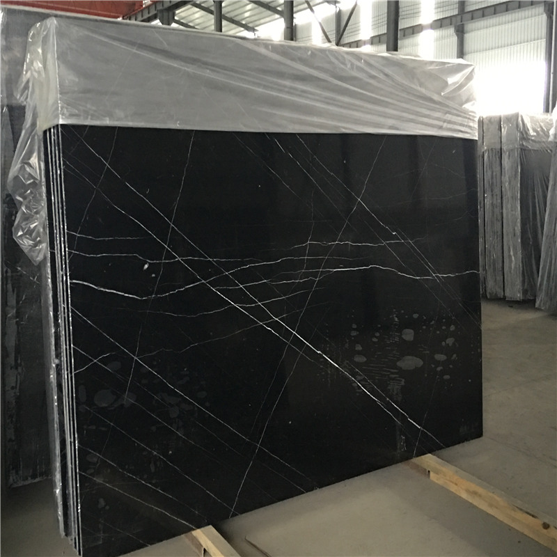 Nero Marquina Marble i vit rand