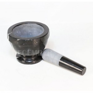 Svart marmort mortel och stöt