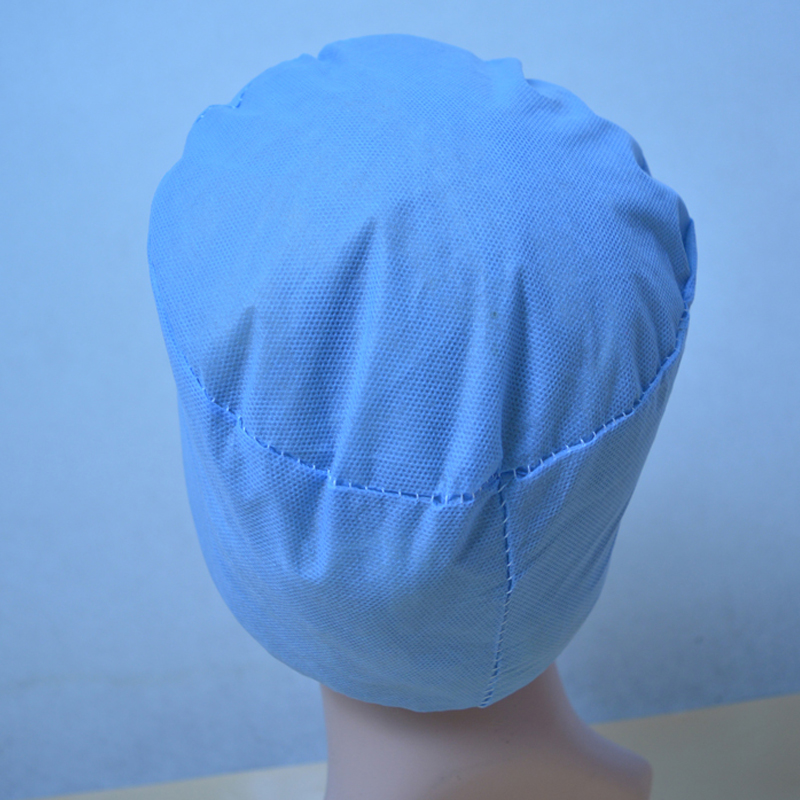 Engångs kirurgisk mössa