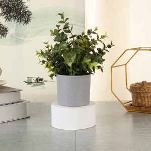 Hög simulering riktiga berörda konstgjorda gröna växter i kruka för heminredning