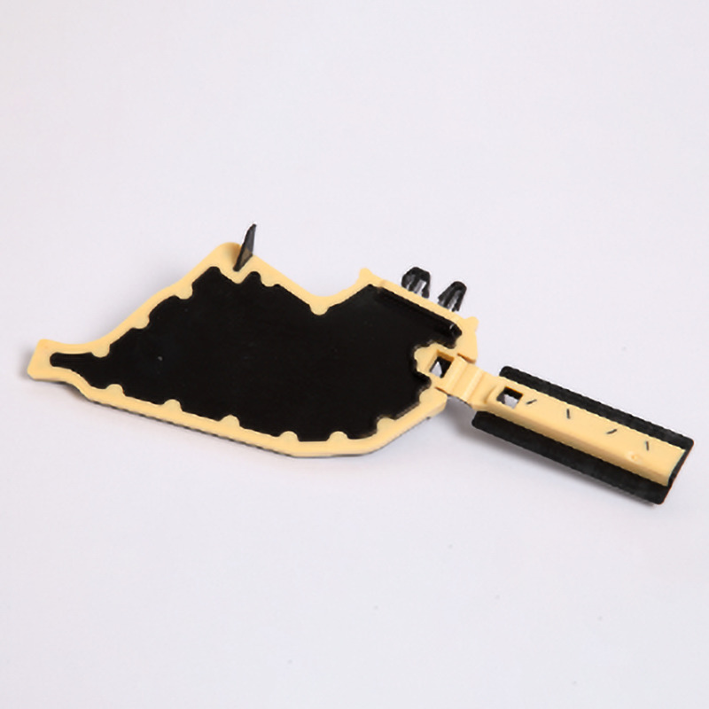 Dubbelfärgad plastdel